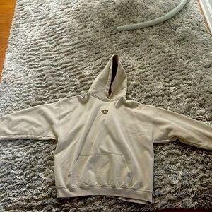 This is a Something Bigger sweatshirt that promotes body positivity